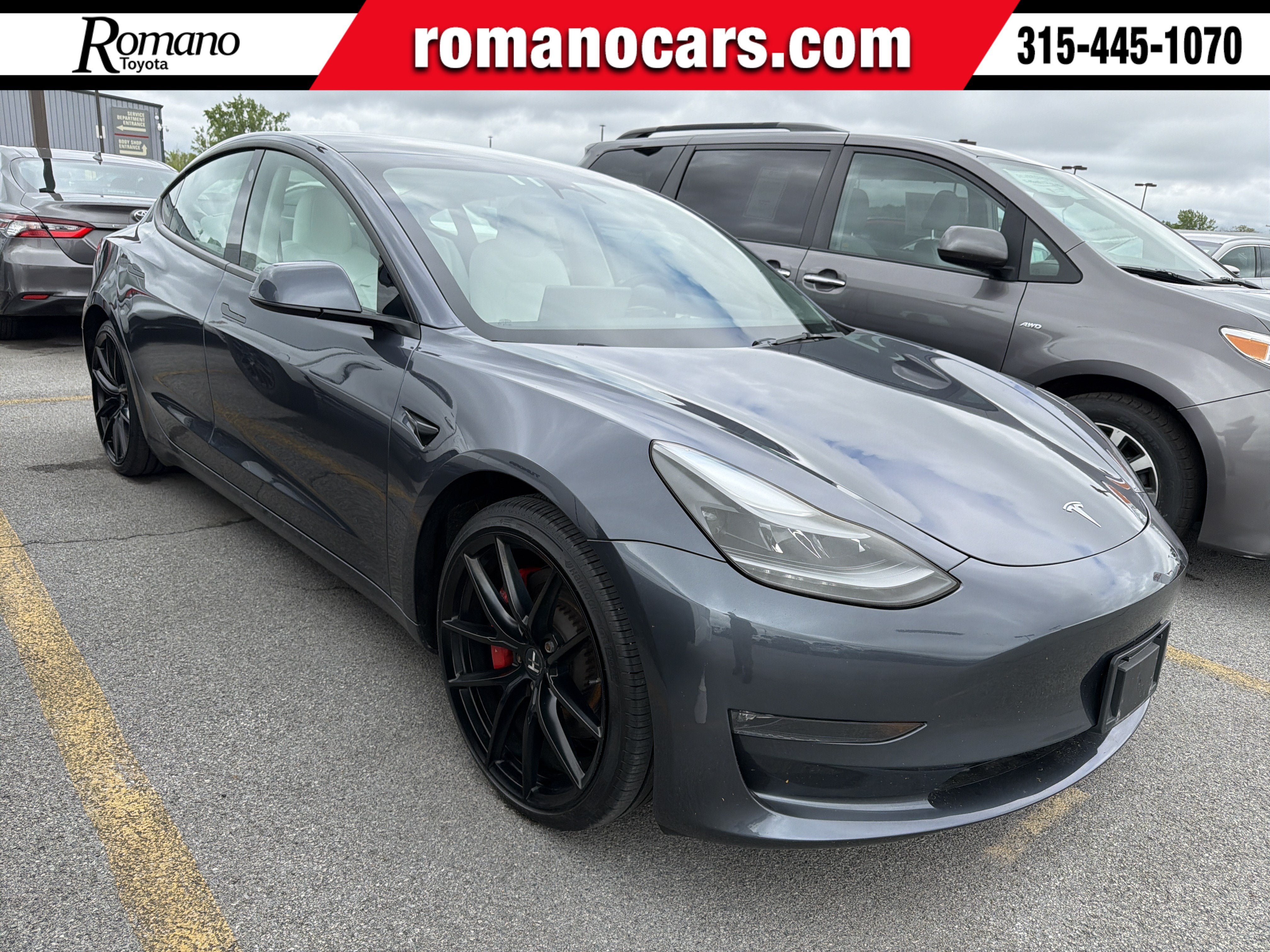 2023 Tesla Model 3 Performance in Midnight Silver Metallic — front three-quarter view