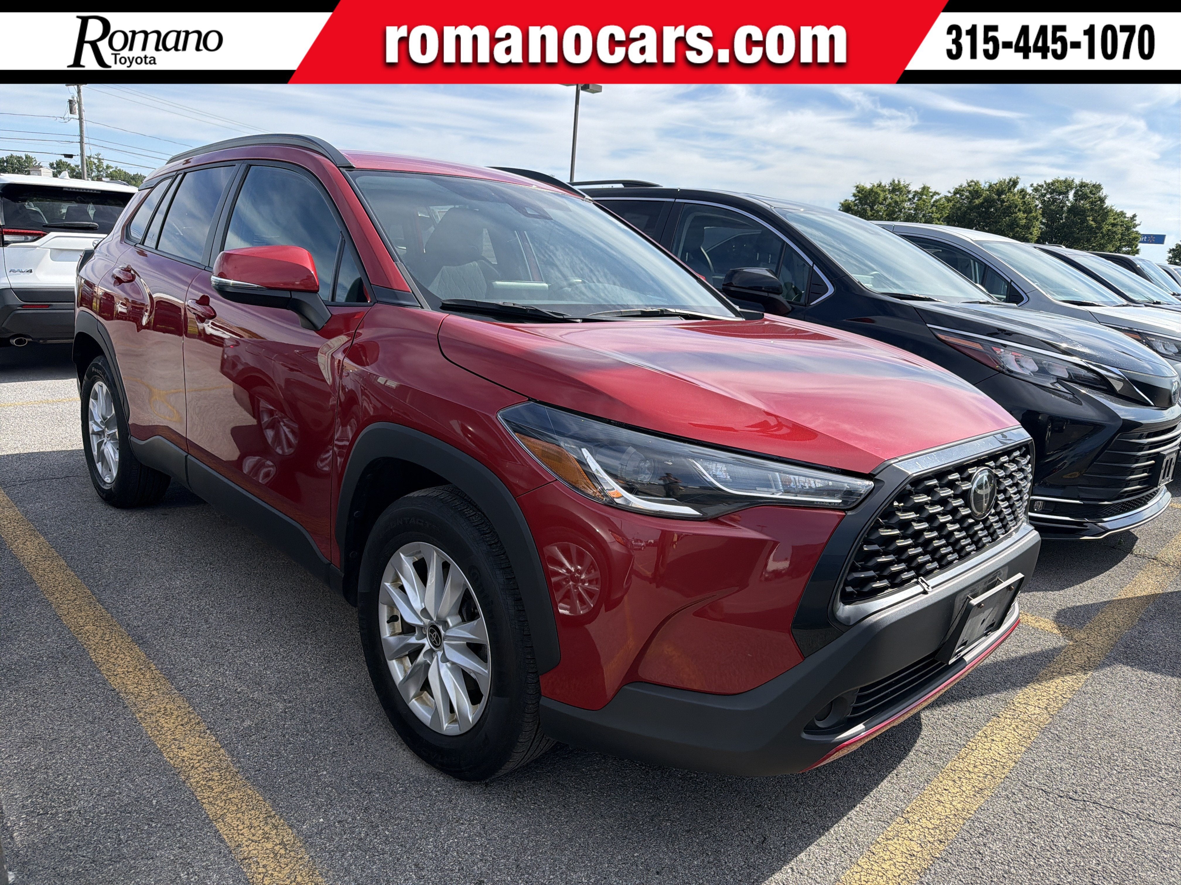 2022 Toyota Corolla Cross LE in Red — front three-quarter view