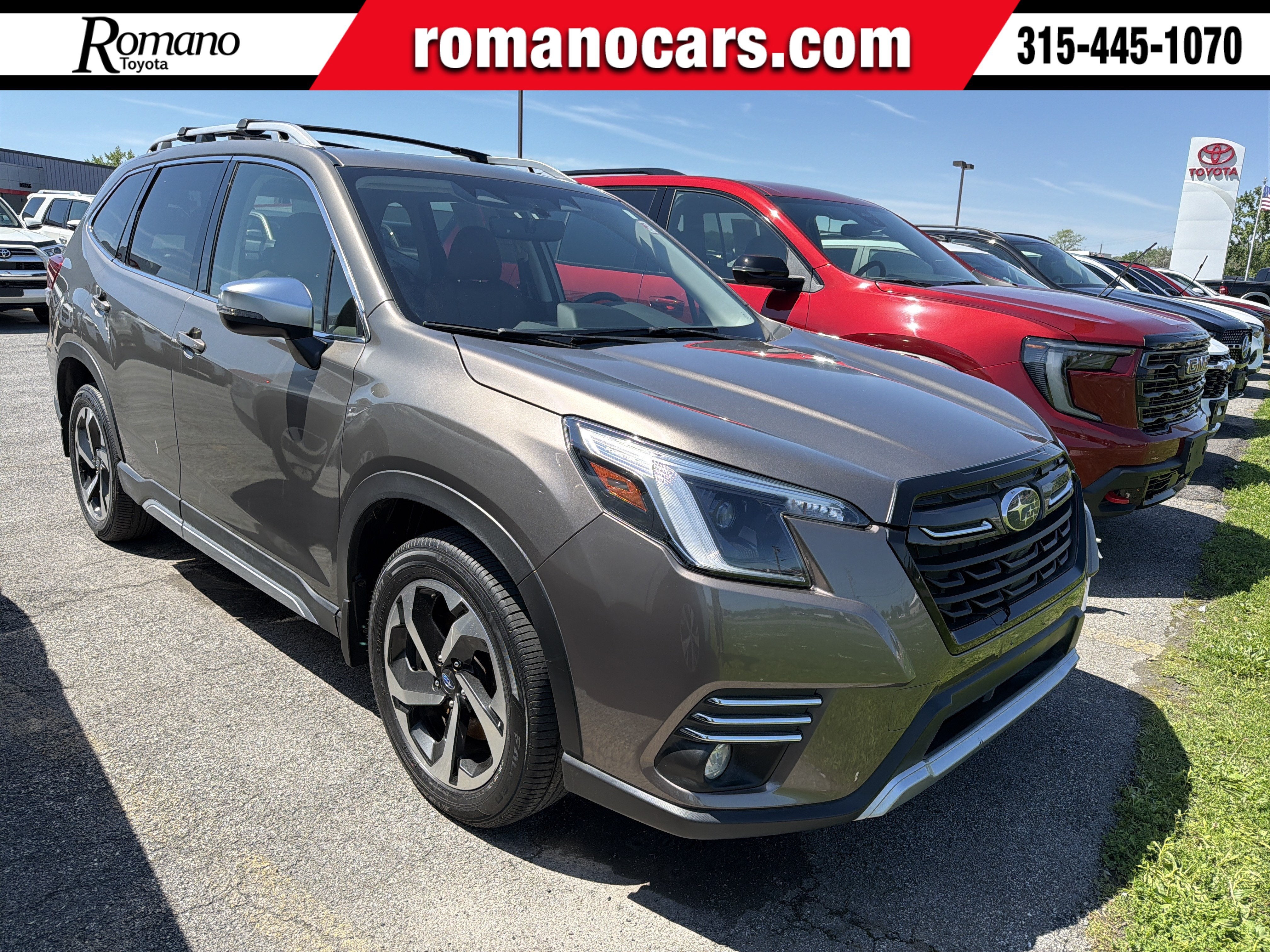 2024 Subaru Forester Touring in Brilliant Bronze Metallic — front three-quarter view