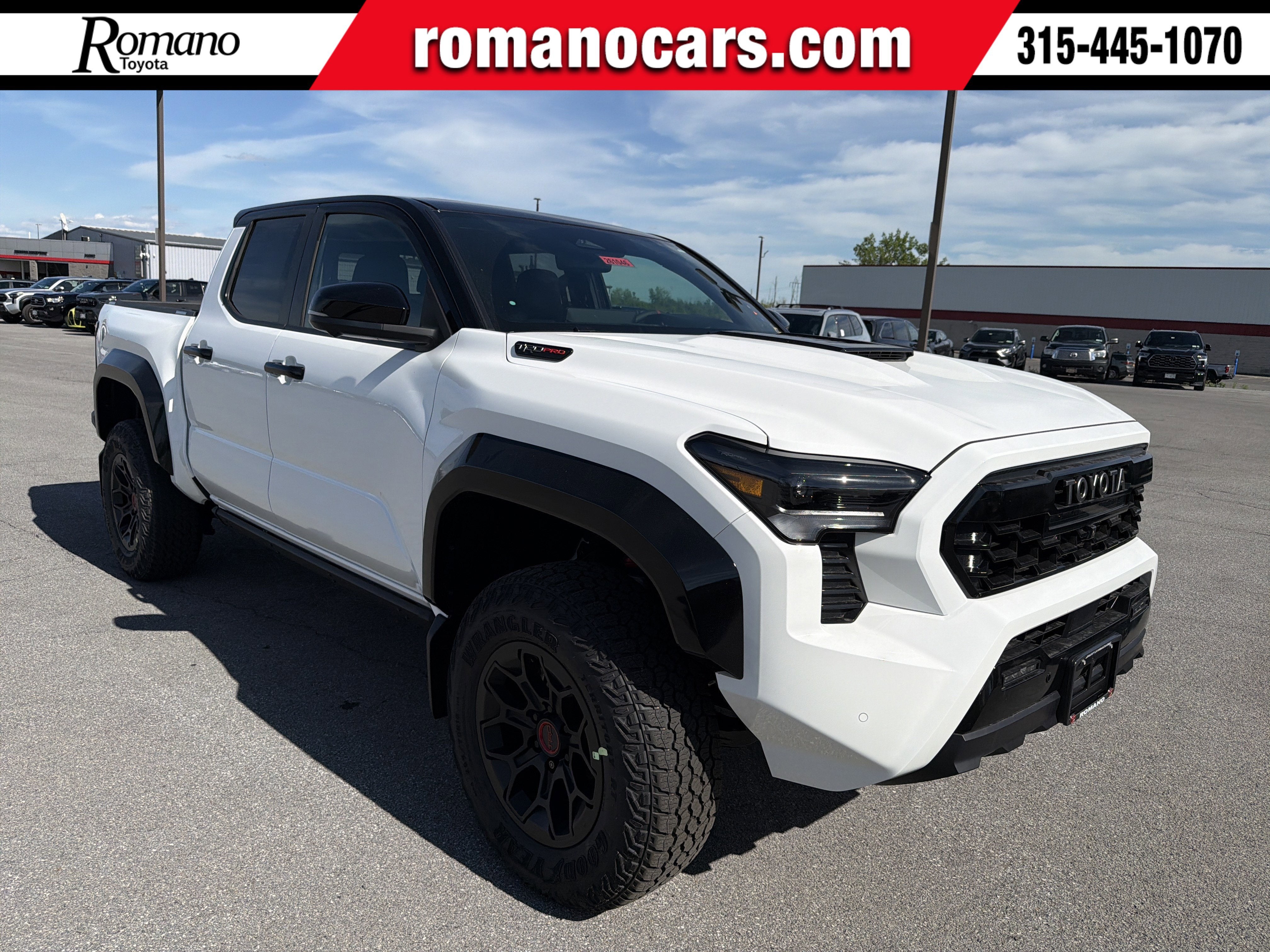2026 Toyota Tacoma i-FORCE MAX Tacoma TRD Pro in Ice Cap With Black Roof — front three-quarter view